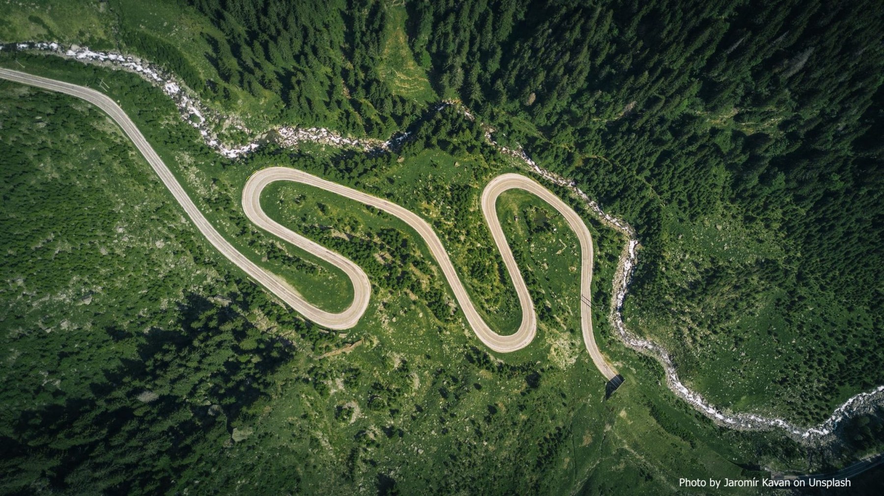 Winding road through green countryside